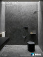 Mortex mineral skin shower application, dark grey finish